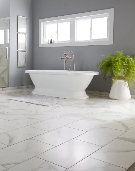 Bathroom featuring elegant tile flooring in neutral tones
