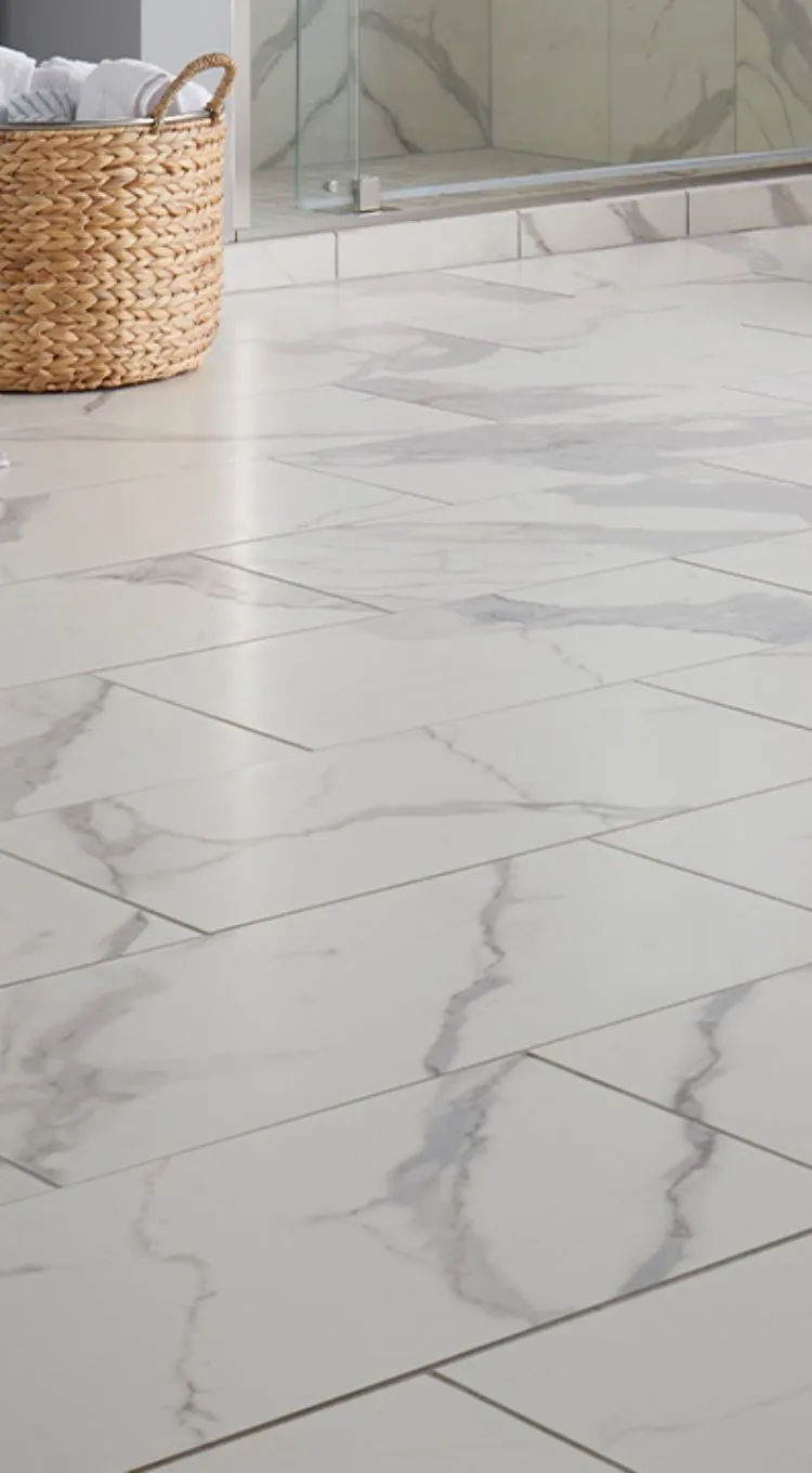 Bathroom featuring elegant tile flooring in neutral tones